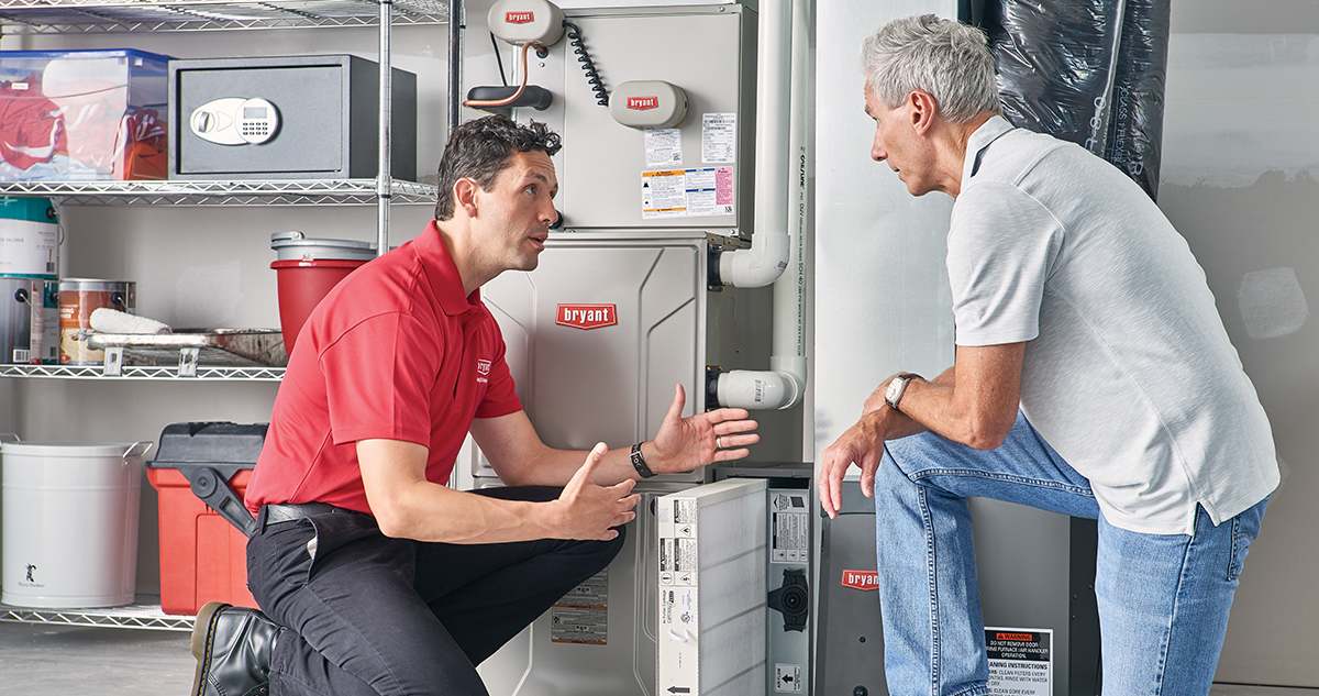 a bryant dealer explains furnace gas valve to homeowner