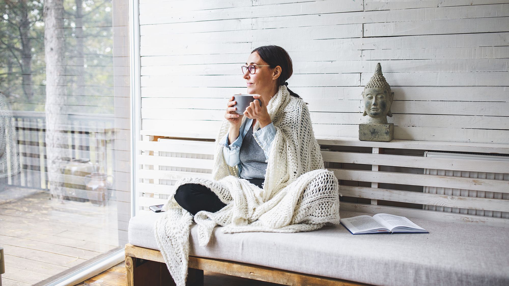 peaceful-woman-sitting-on-bench-outdoors-with-mug peaceful-woman-sitting-on-bench-outdoors-with-mug