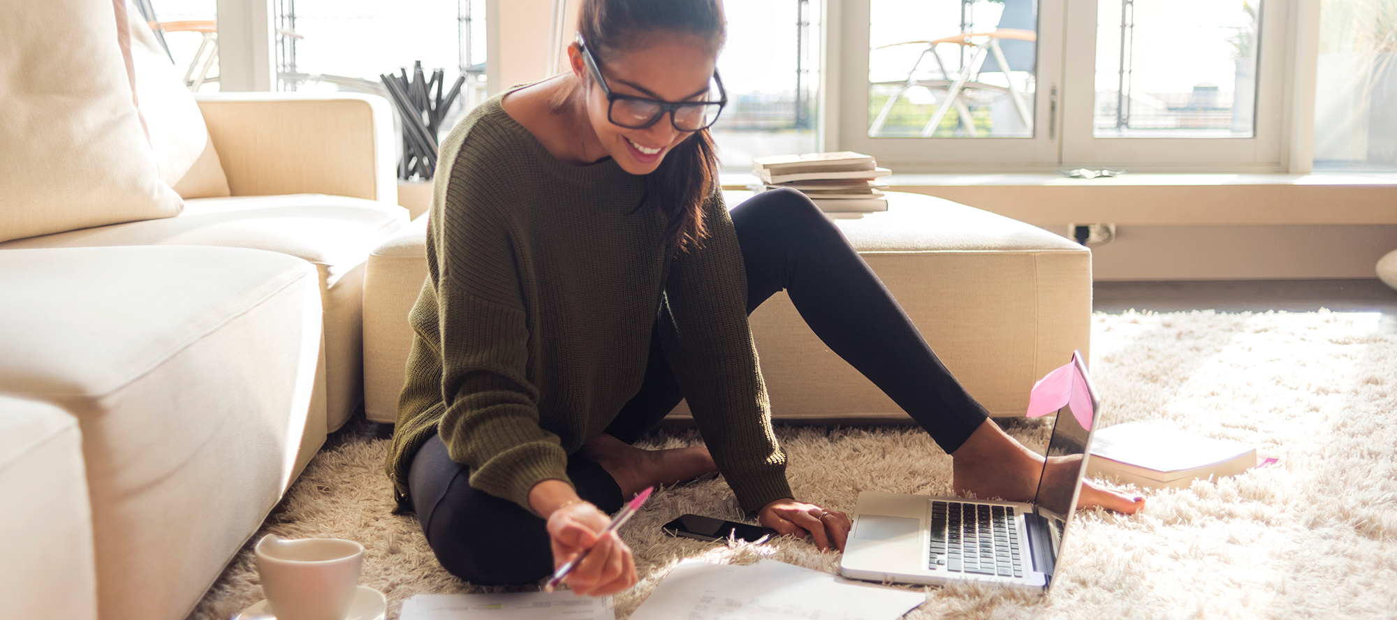 woman-in-sunlight-on-floor-with-papers woman-in-sunlight-on-floor-with-papers