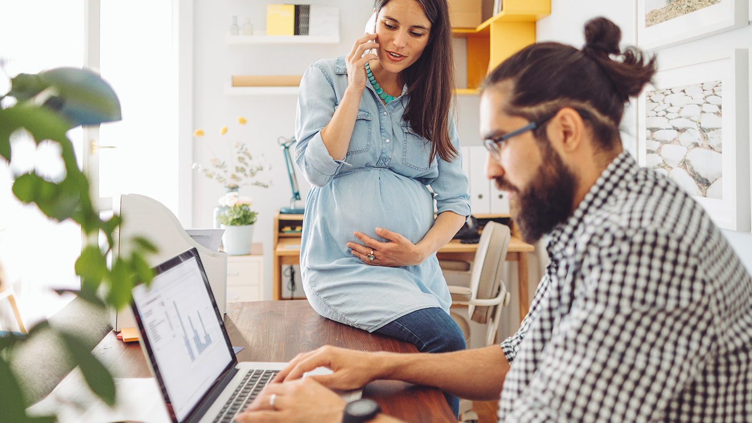 man-and-woman-research-online-at-desk man-and-woman-research-online-at-desk