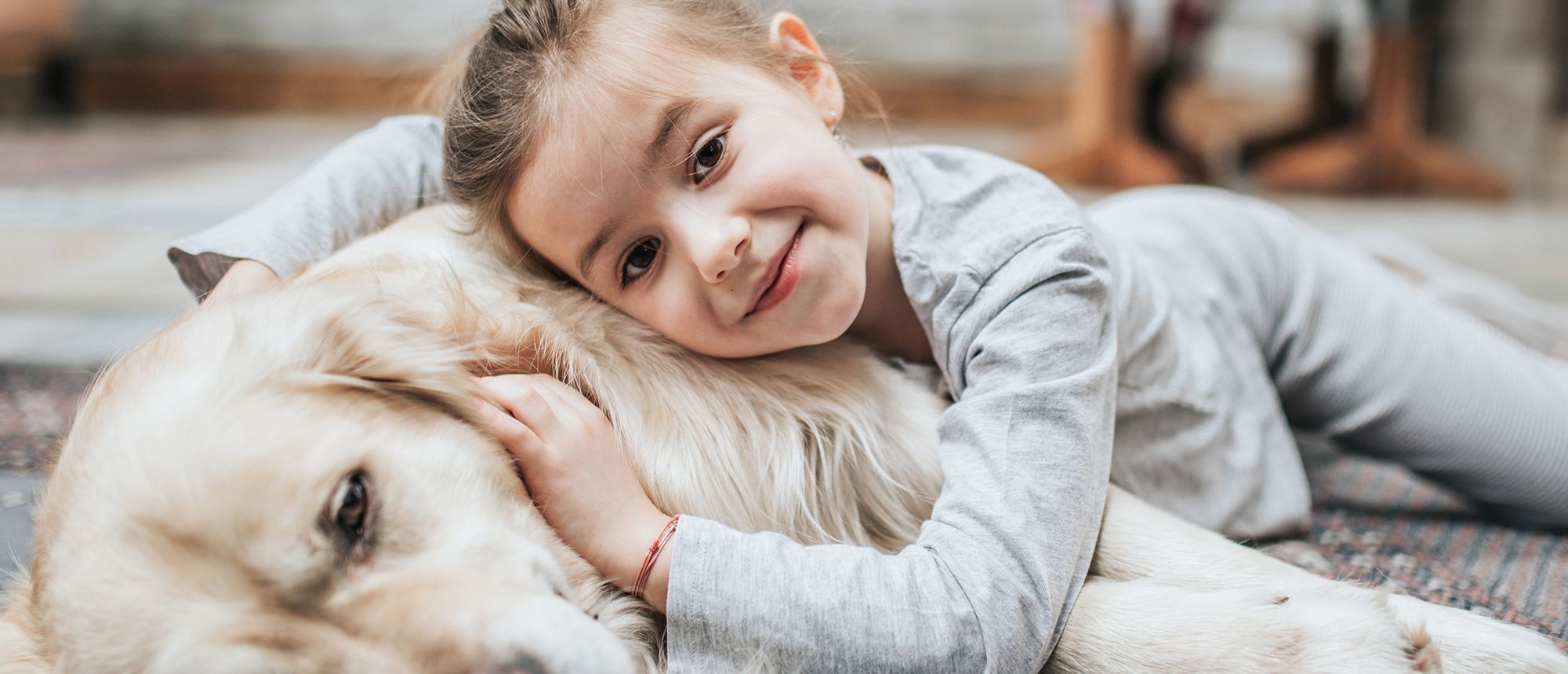 girl-with-dog-on-floor-cropped