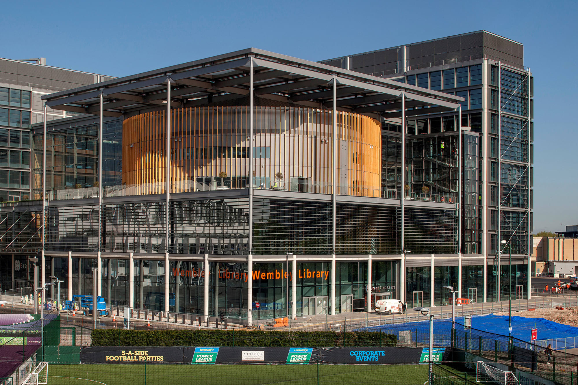 A photo of a modern building with glass and wooden facade A photo of a modern building with glass and wooden facade