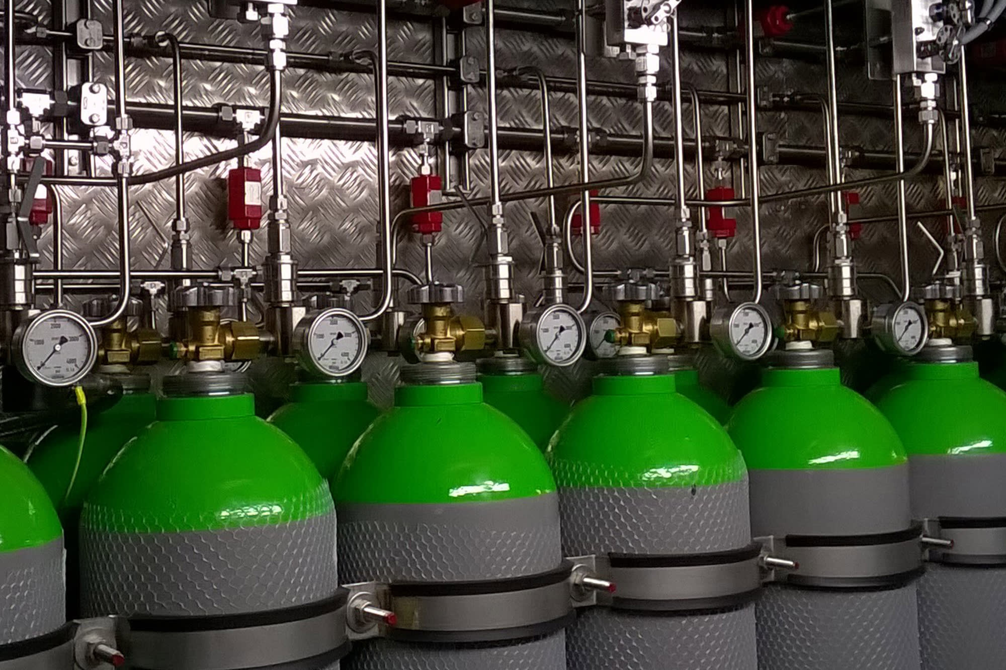 A photo of compressed air bottles installed to high-pressure water mist container A photo of compressed air bottles installed to high-pressure water mist container