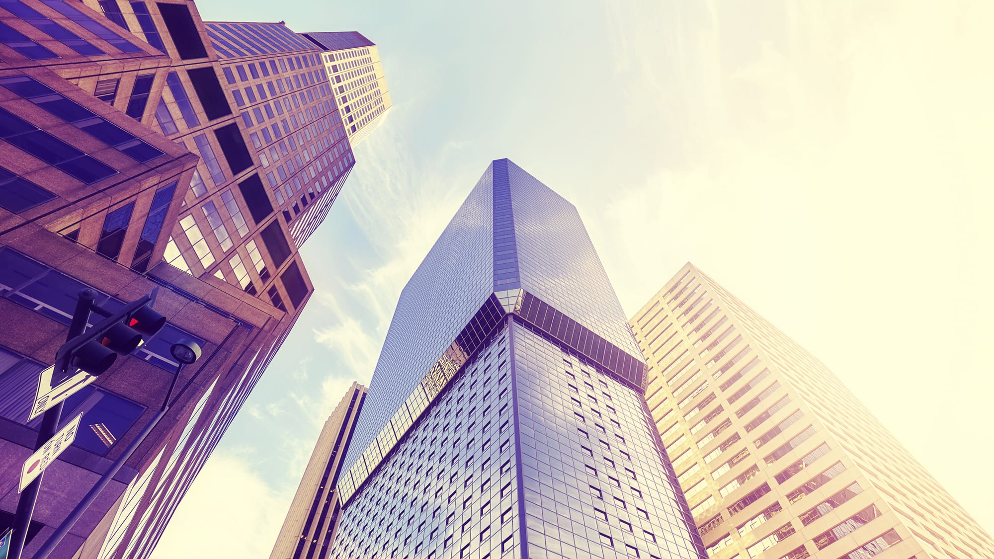 carrier-exterior-of-skyscrapers-at-dusk-looking-up