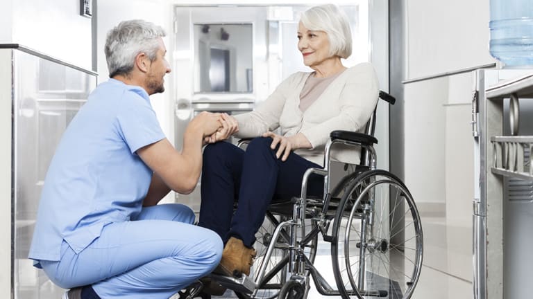 carrier-healthcare-worker-with-older-woman-in-wheelchair-card