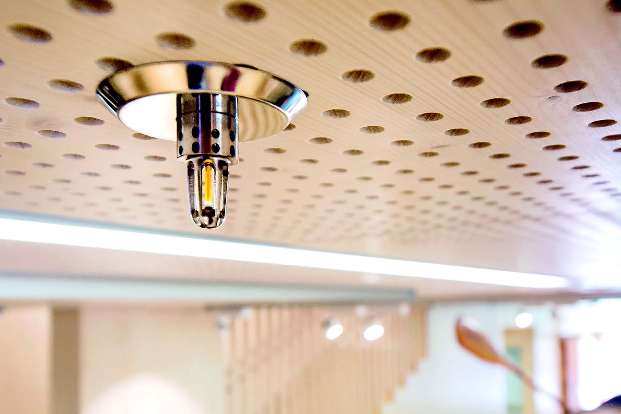 A Marioff HI-FOG sprinkler installed in the ceiling.