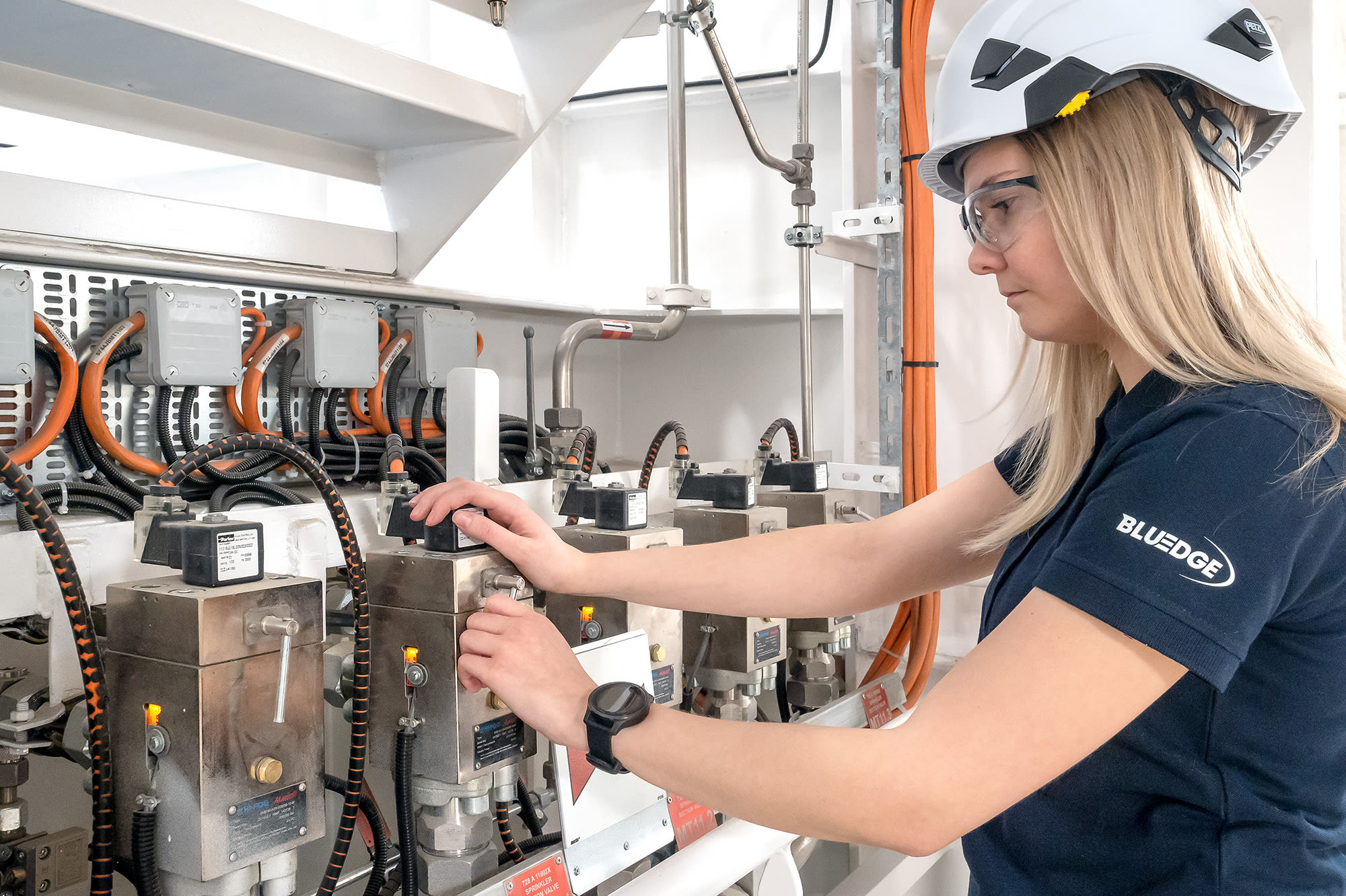 A Marioff Bluedge service professional working with HI-FOG section valves.