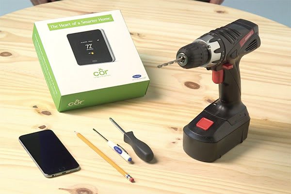 cor-thermostat-on-the-table-along-with-other-things