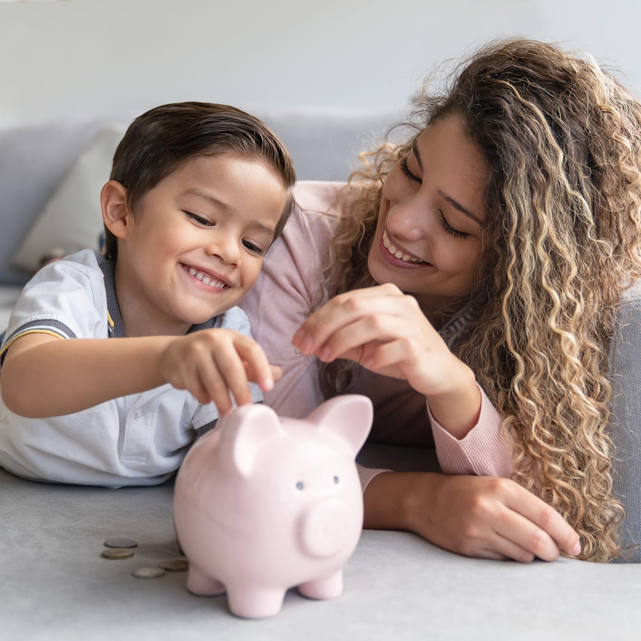mother-and-child-with-piggy-bank-mb