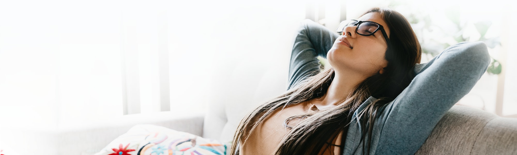 young-woman-smiling-and-relaxing-at-home