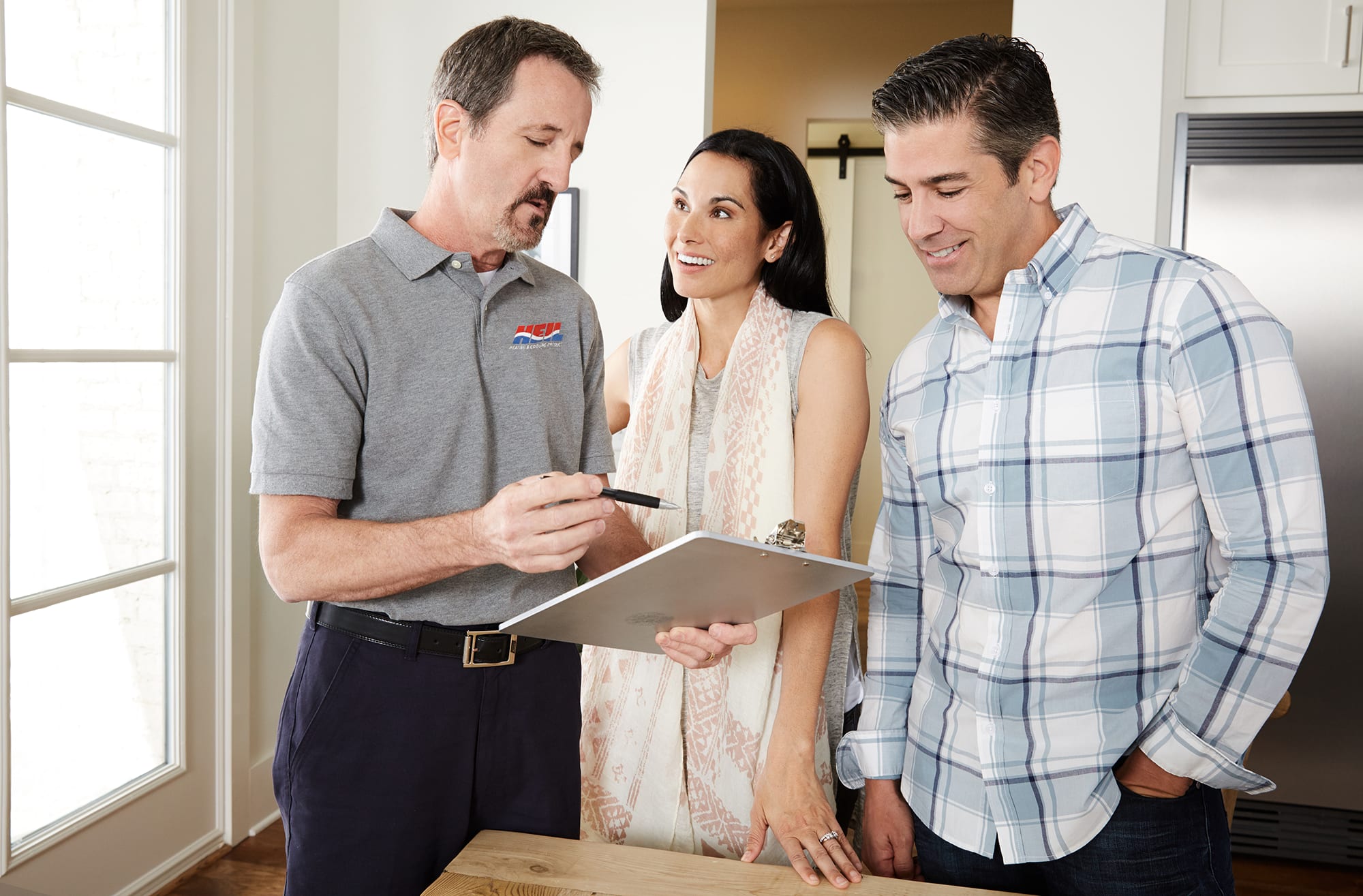 dealer-and-home-owner-looking-at-buying-guide