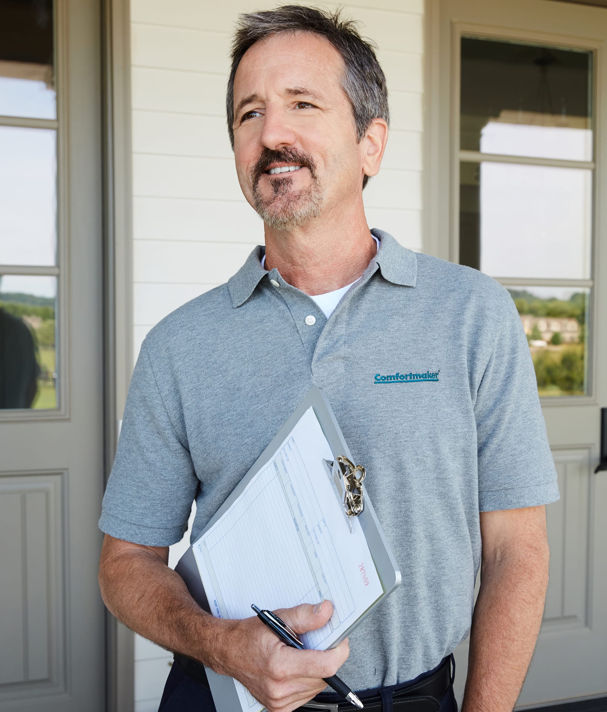 elite-dealer-in-front-of-house