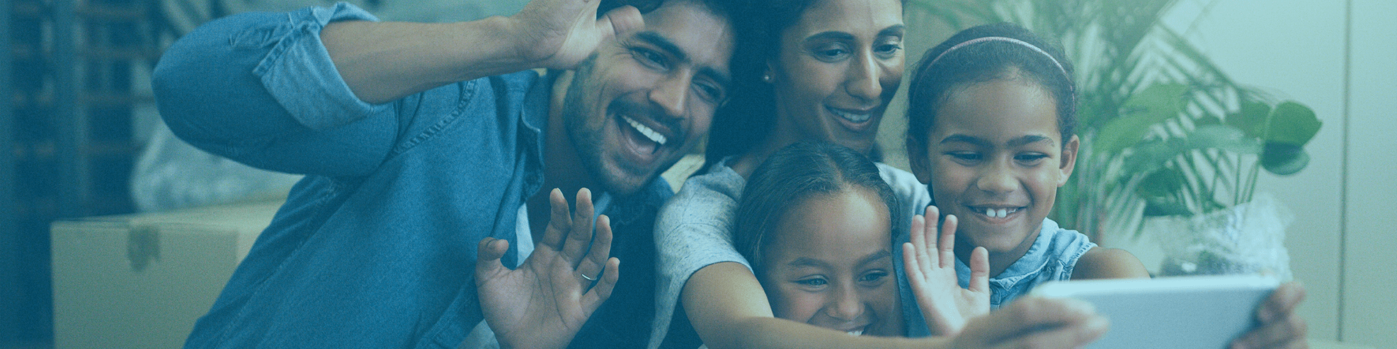 happy-family-looking-at-tablet