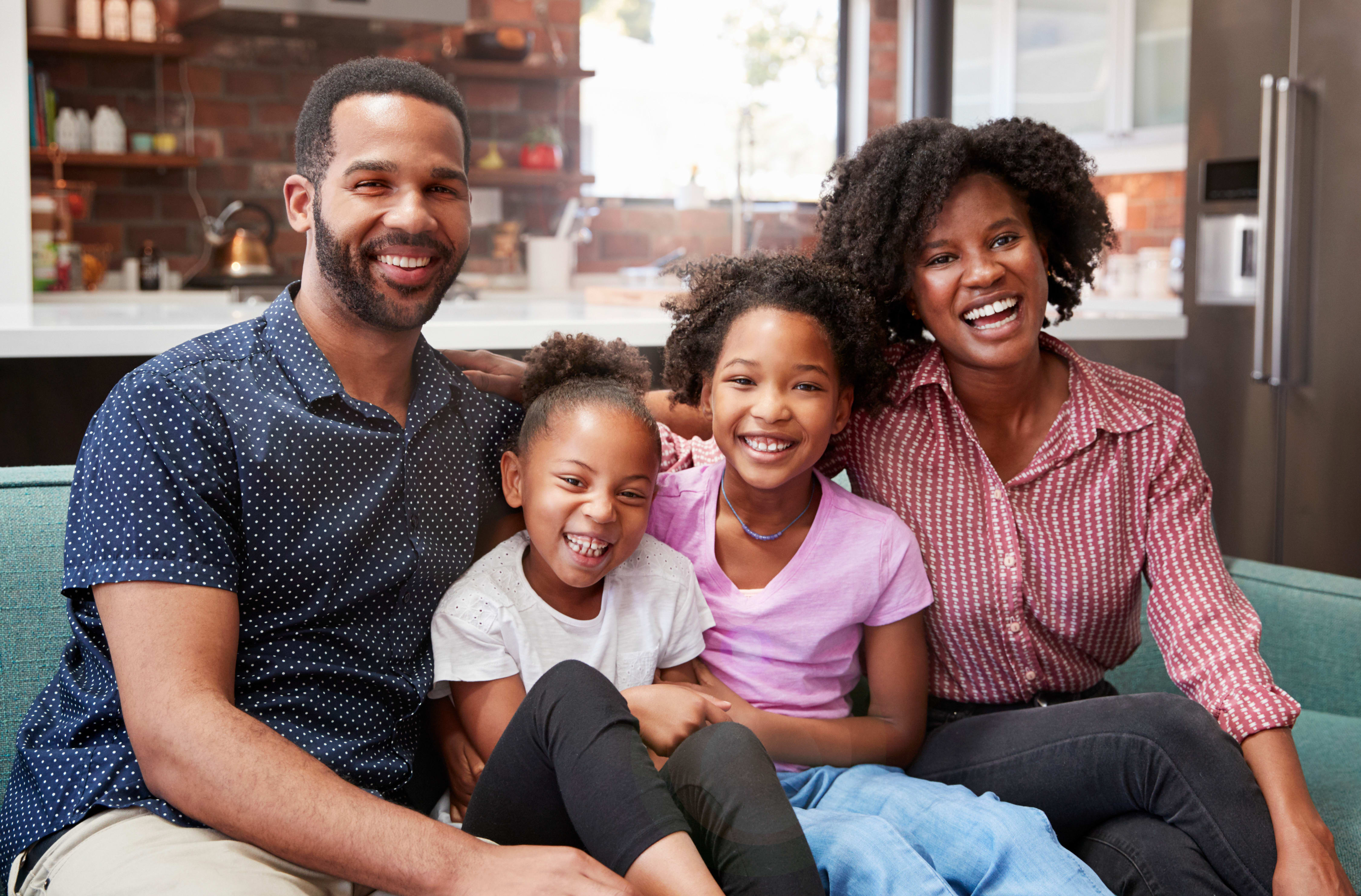 family-on-couch-enjoying-home-comfort