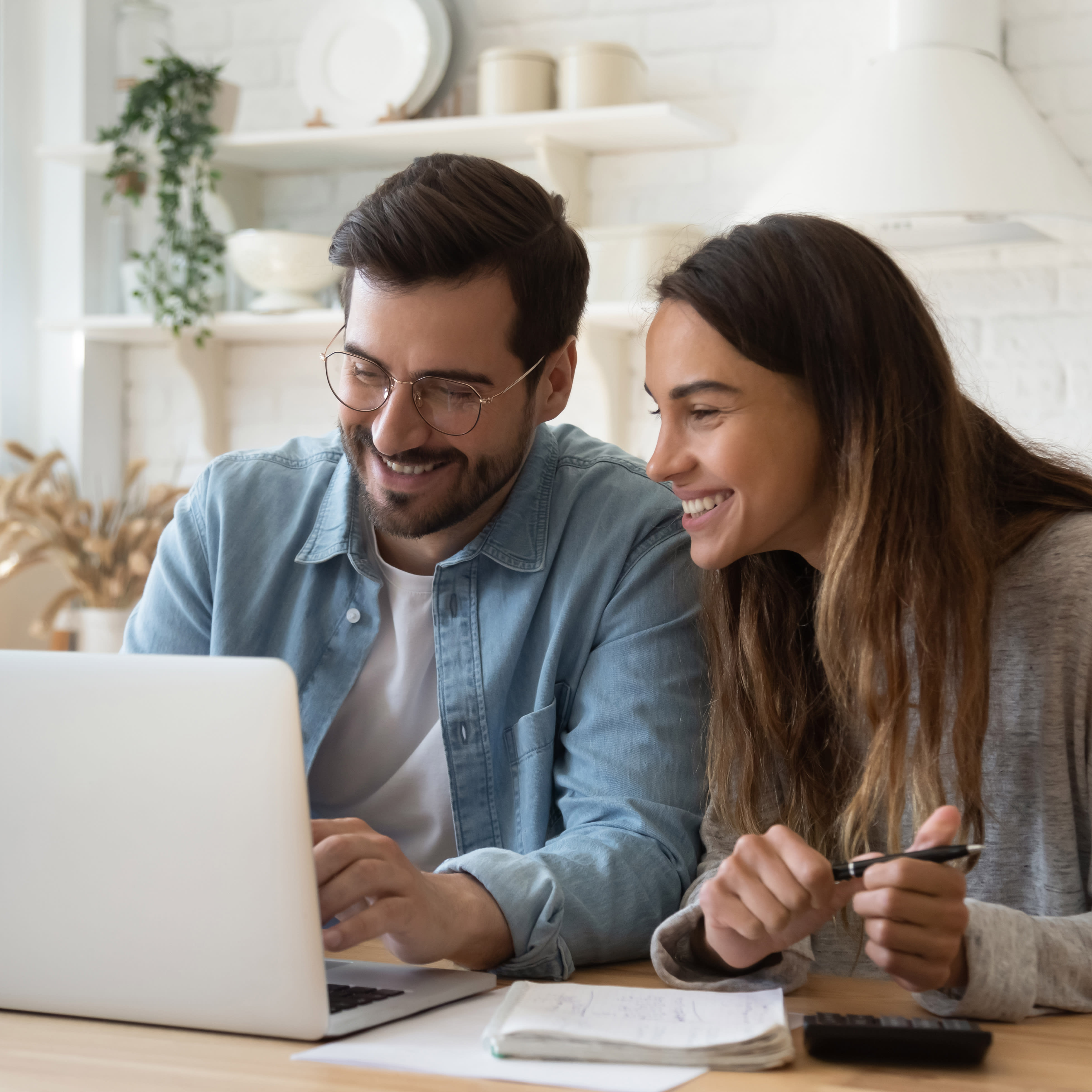 a man and woman research local utility rebates