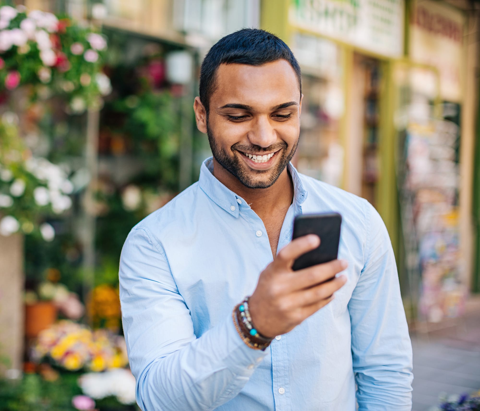 man-phone-street-flower-shop