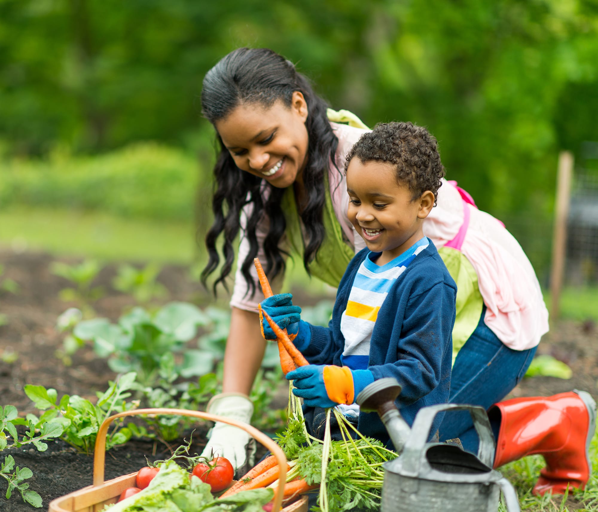 mother and son play in garden talking about HVAC energy consumption