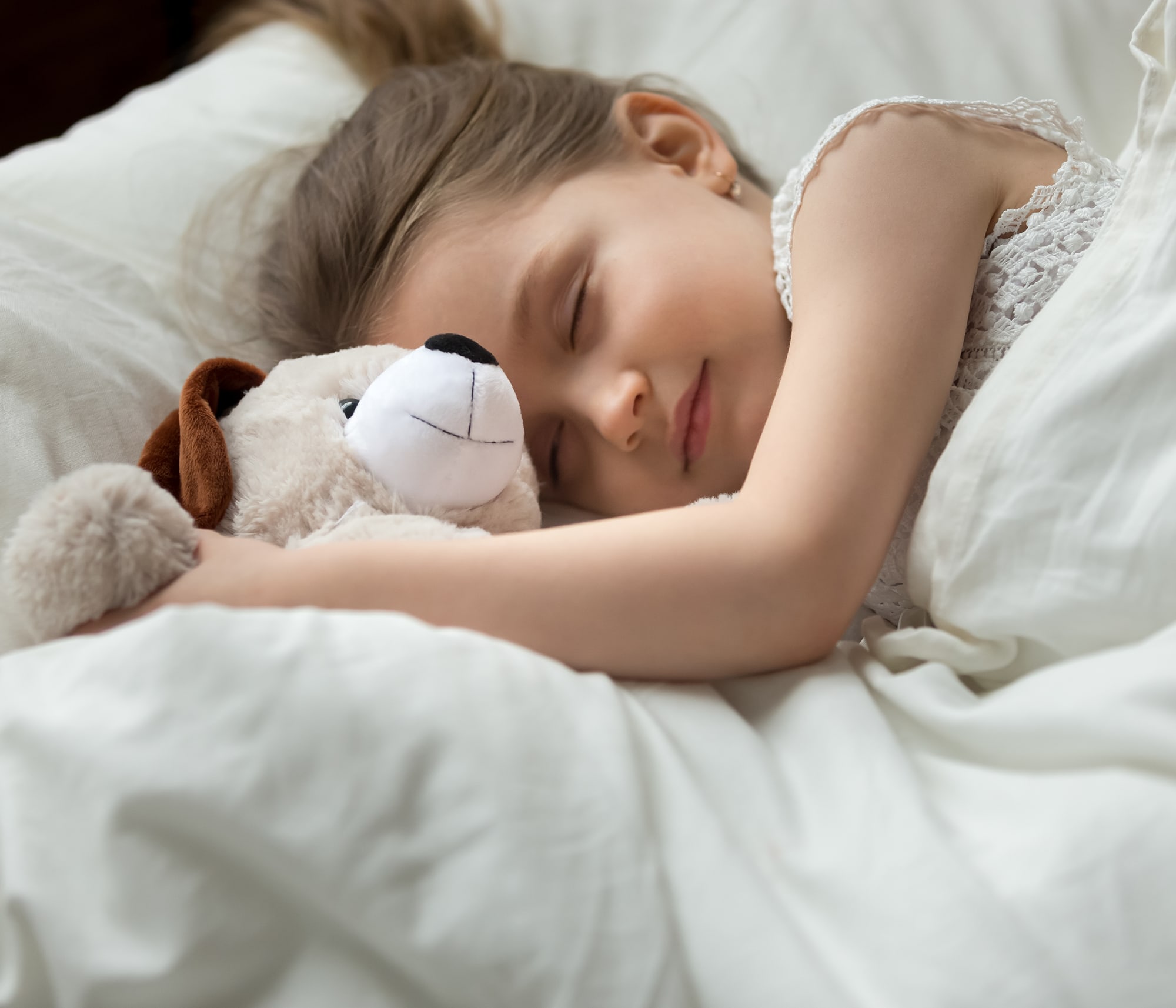 girl sleeping peacefully due to quiet HVAC equipment