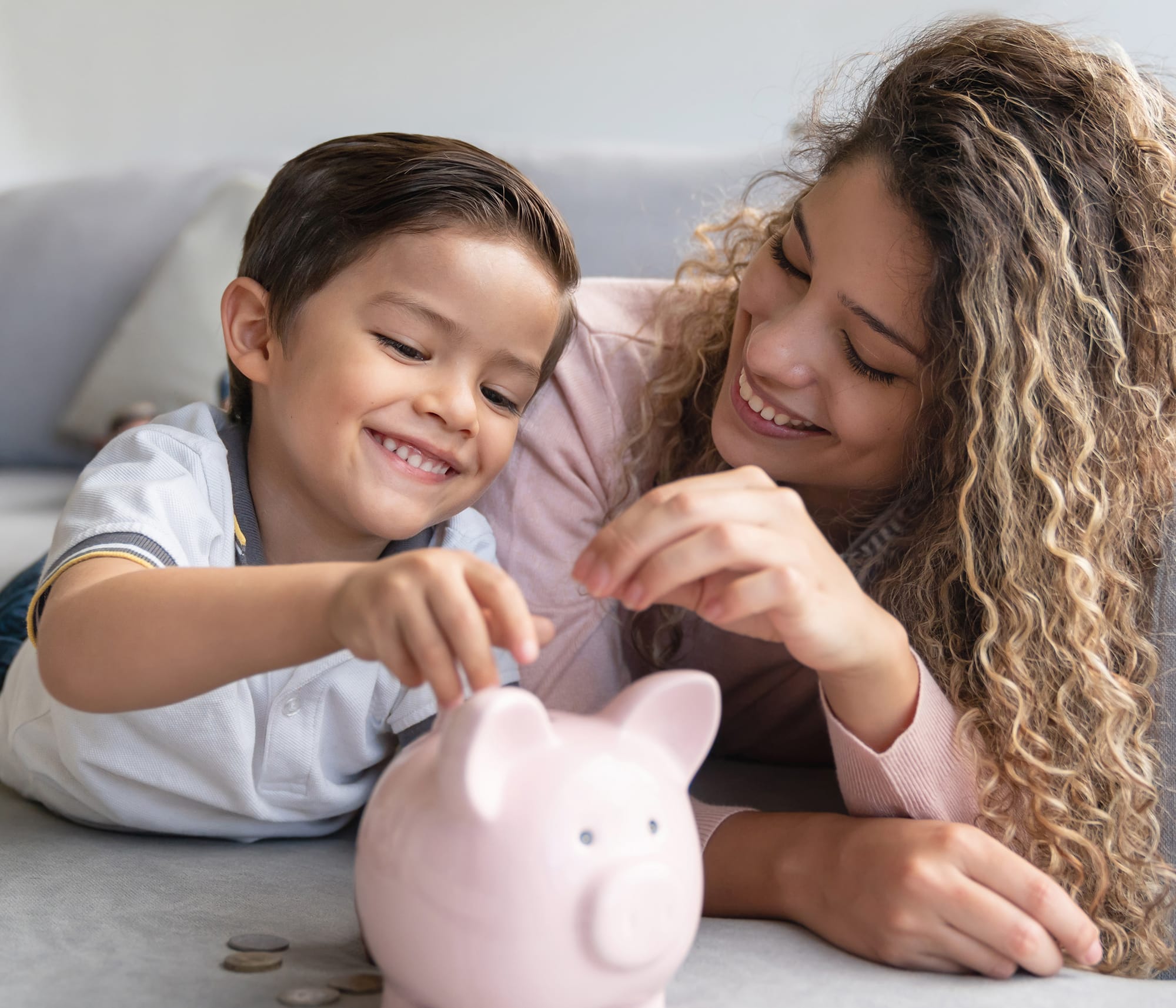 mom-and-son-with-piggy-bank-and-coins