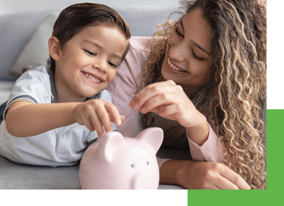 mom and son playing with piggybank talking about energy efficient innovation