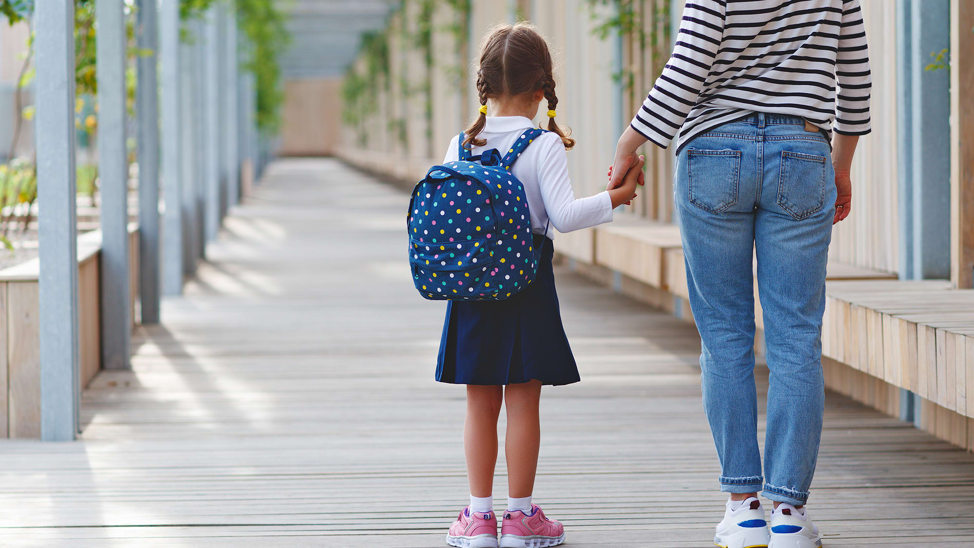 little-girl-holding-parents-hand
