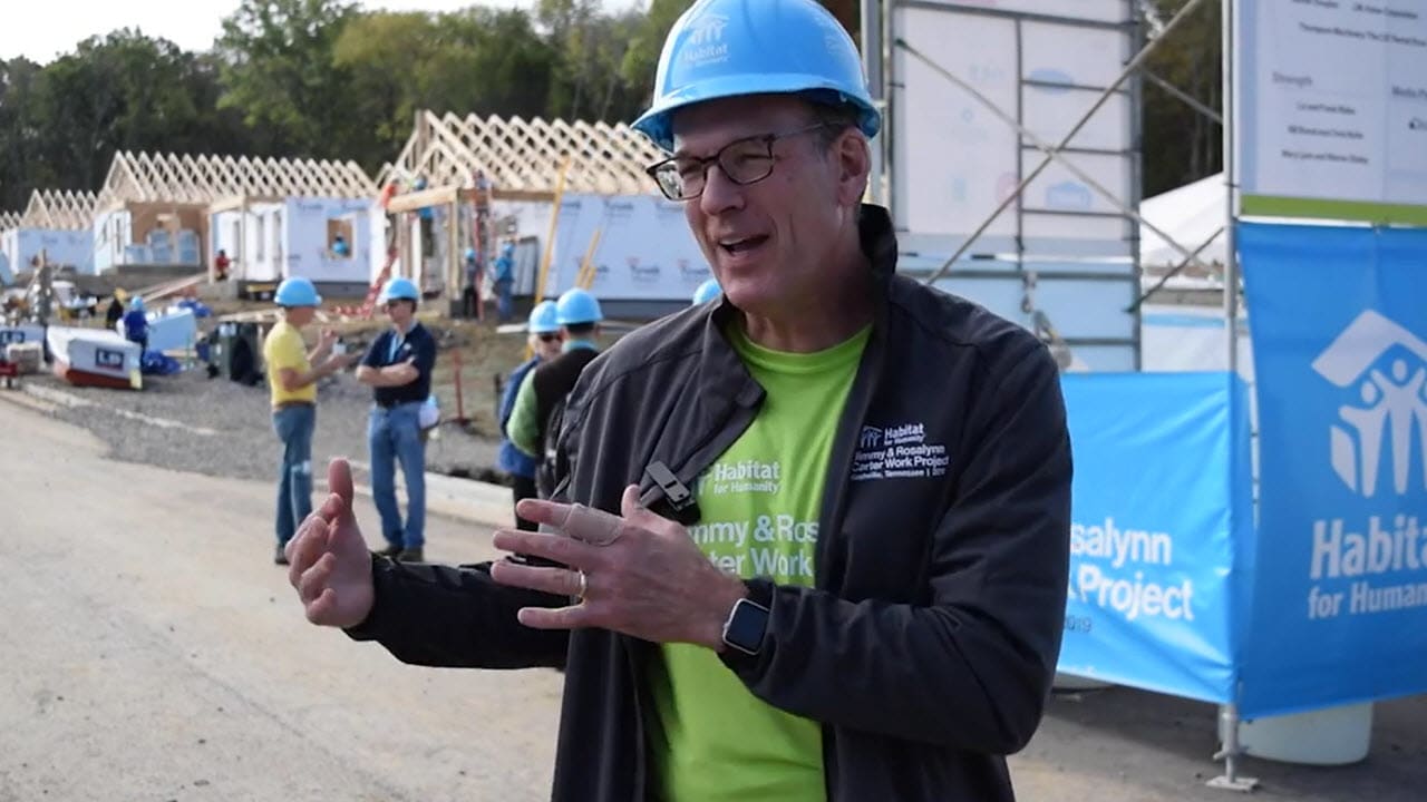 a man talks about carrier's partnership with habitat for humanity
