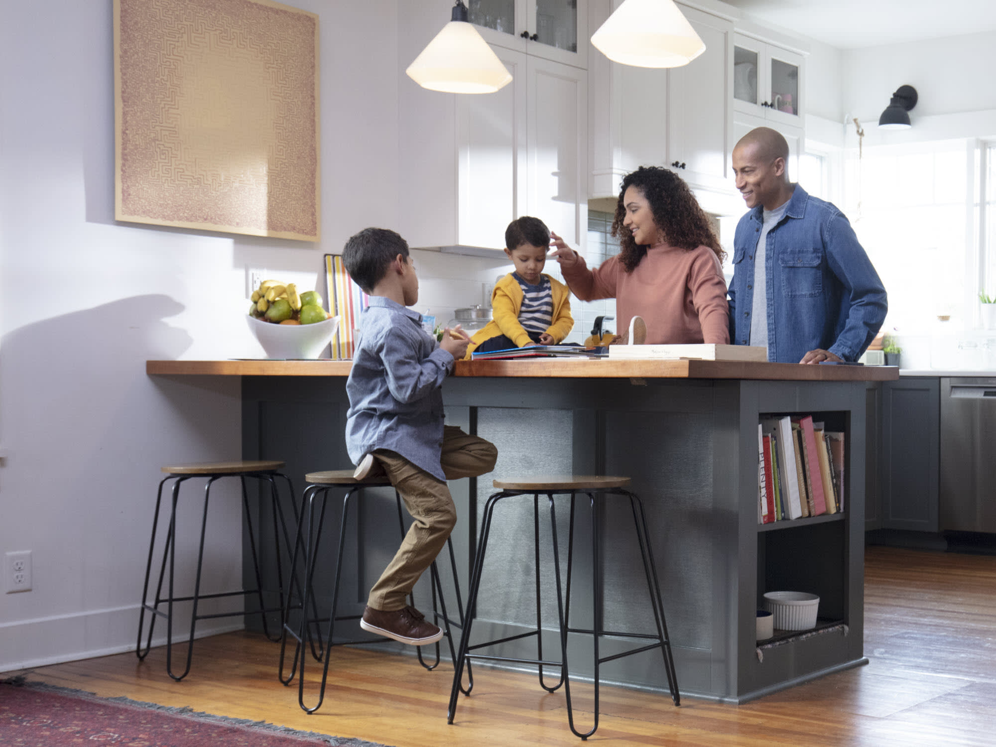 family-in-kitchen-green-cabinets
