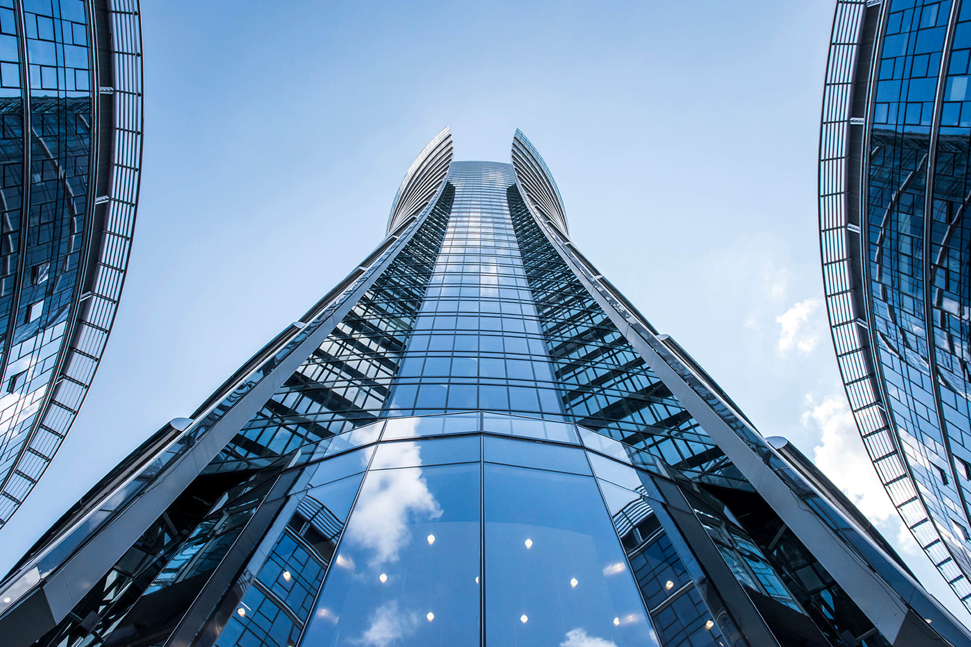 Close up of a glass wall on the Warsaw Spire high-rise building.