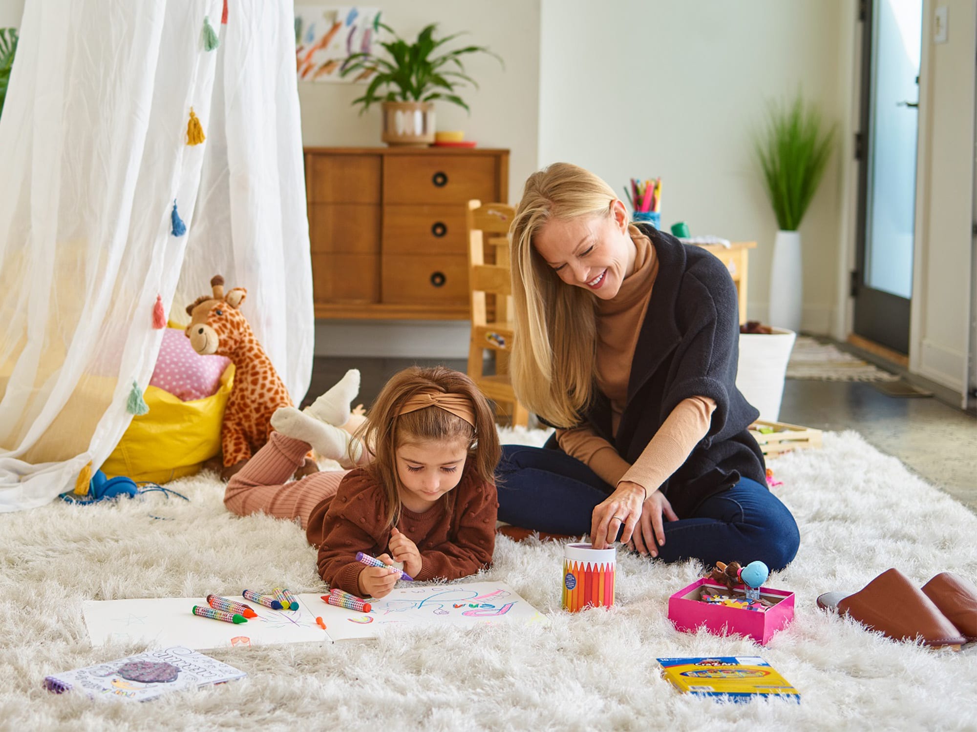 mother-daughter-coloring-sitting-on-rug
