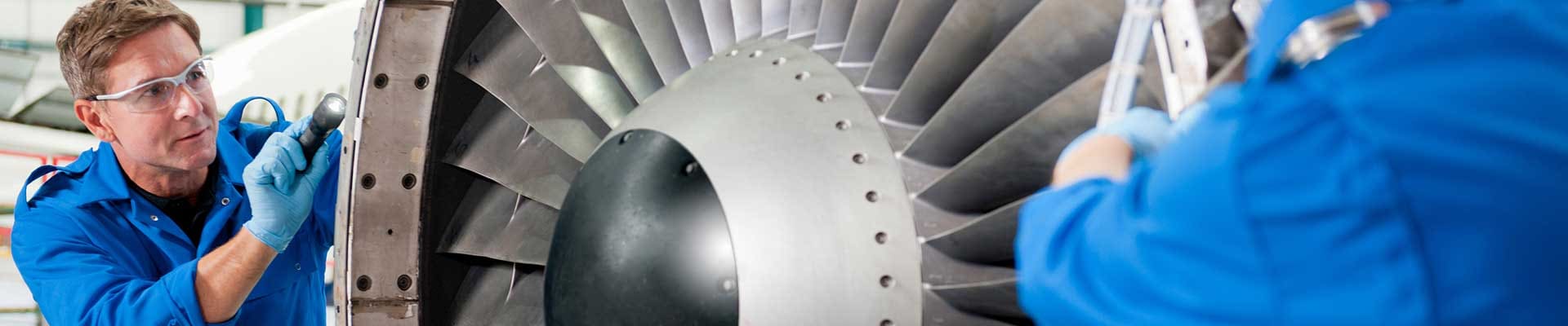 Men-working-with-aircraft-engine