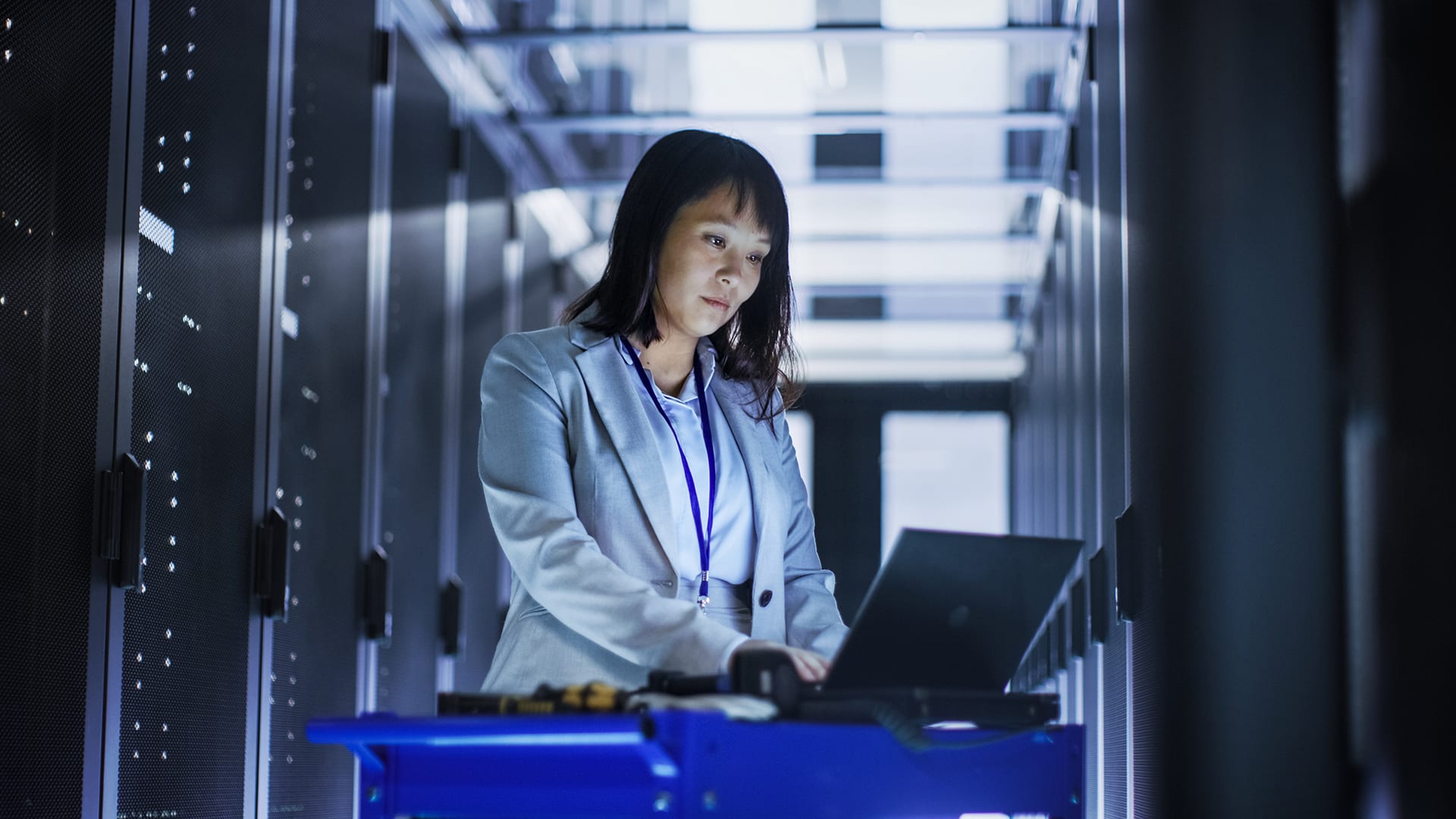 woman-on-laptop-in-server-room