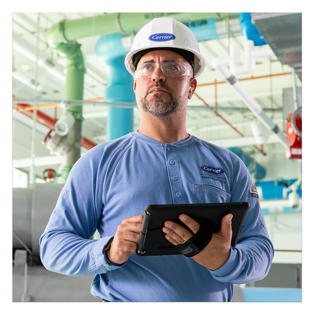 service-tech-on-tablet-in-mechanical-room-1x1