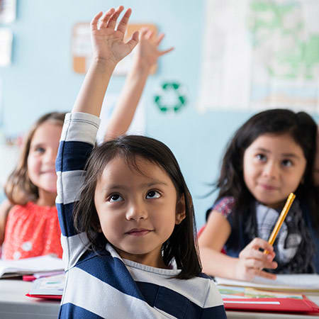 little-girl-in-classroom-raising-hand-1x1