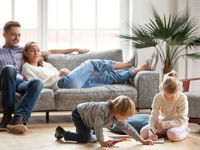 family-in-living-room-watching-kids-play_4-3