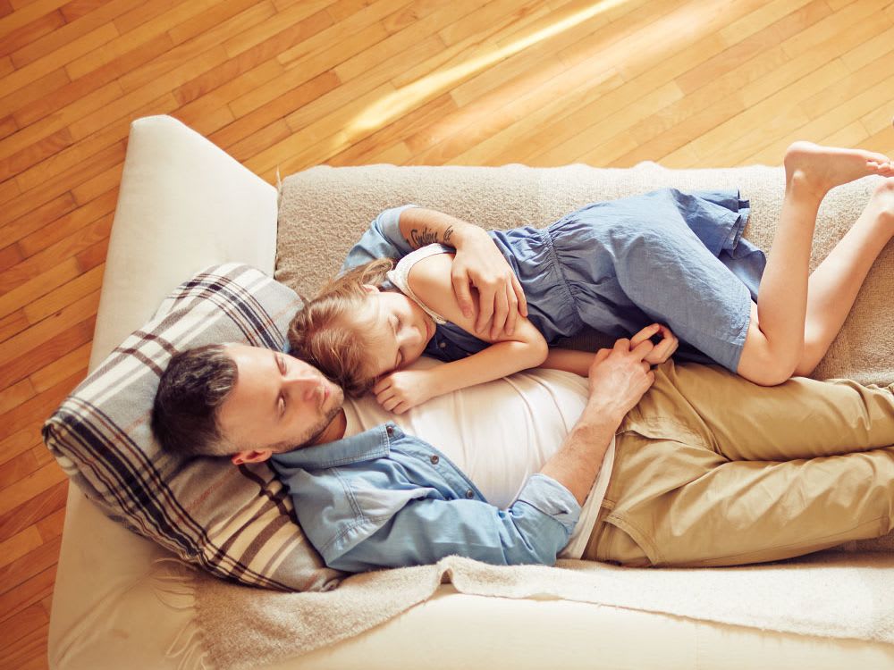 family-relaxing-on-couch-banner-4-3