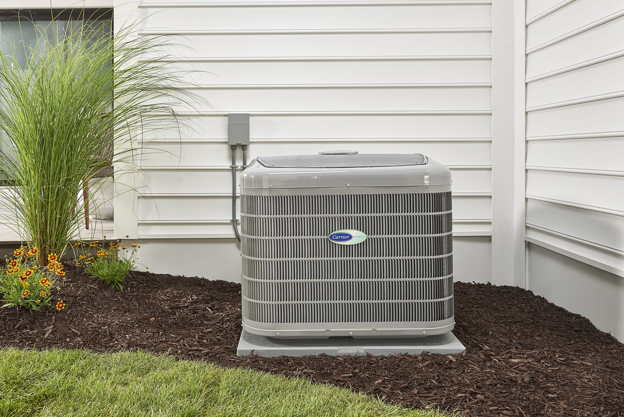 a sustainable heat pump installed outside of a home