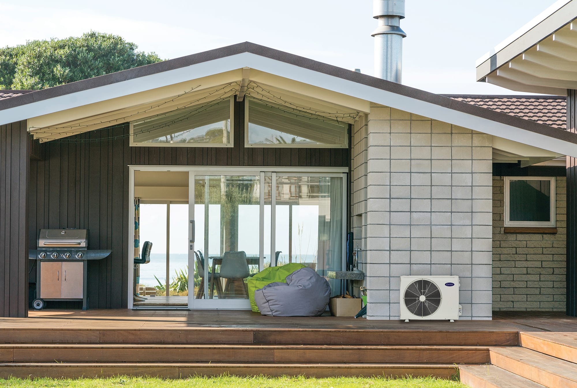 a ductless mini split heat pump installed on an outdoor patio