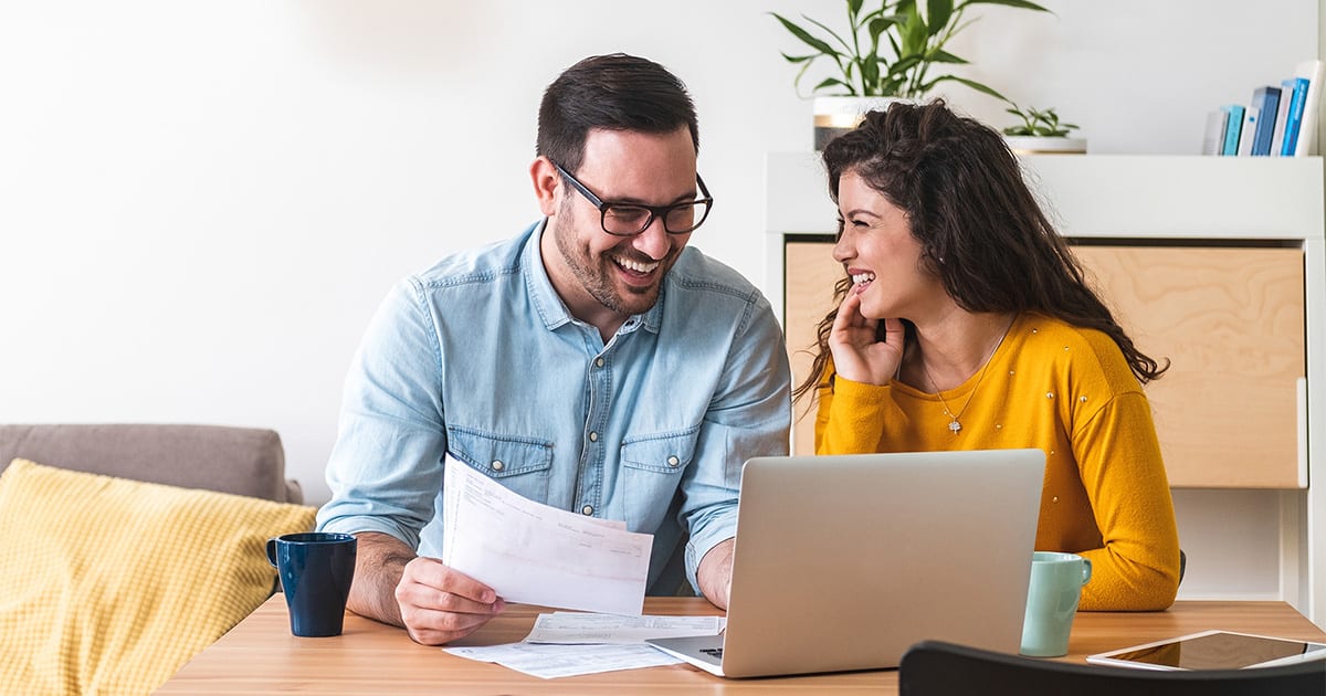 couple researching federal tax credit and heat pump tax credit