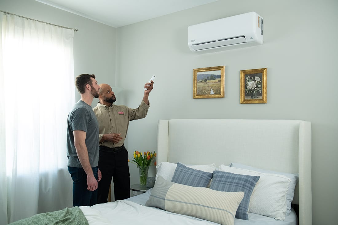 bryant-dealer-explains-ductless-mini-split-unit-to-homeowner
