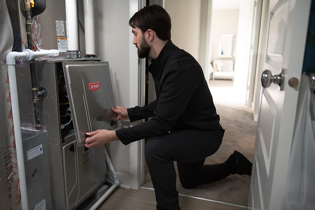 bryant-dealer-finishes-servicing-an-hvac-system