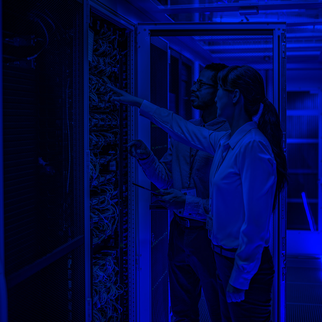 man-woman-in-data-center-mb