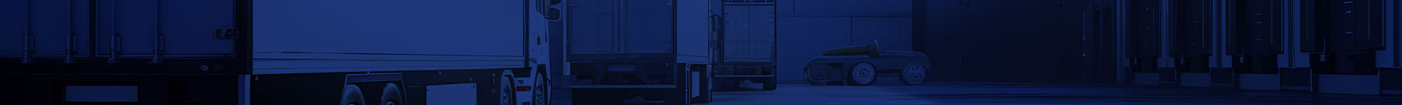 dark blue background over image of trailers at a distribution center