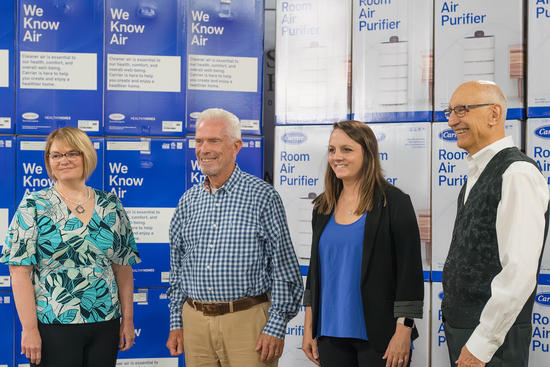 Kim Brock (Second Harvest Food Bank), Bill Johnson (U.S. Rep.), Bridget Volz (Carrier), Mike Iberis (Second Harvest Food Bank)