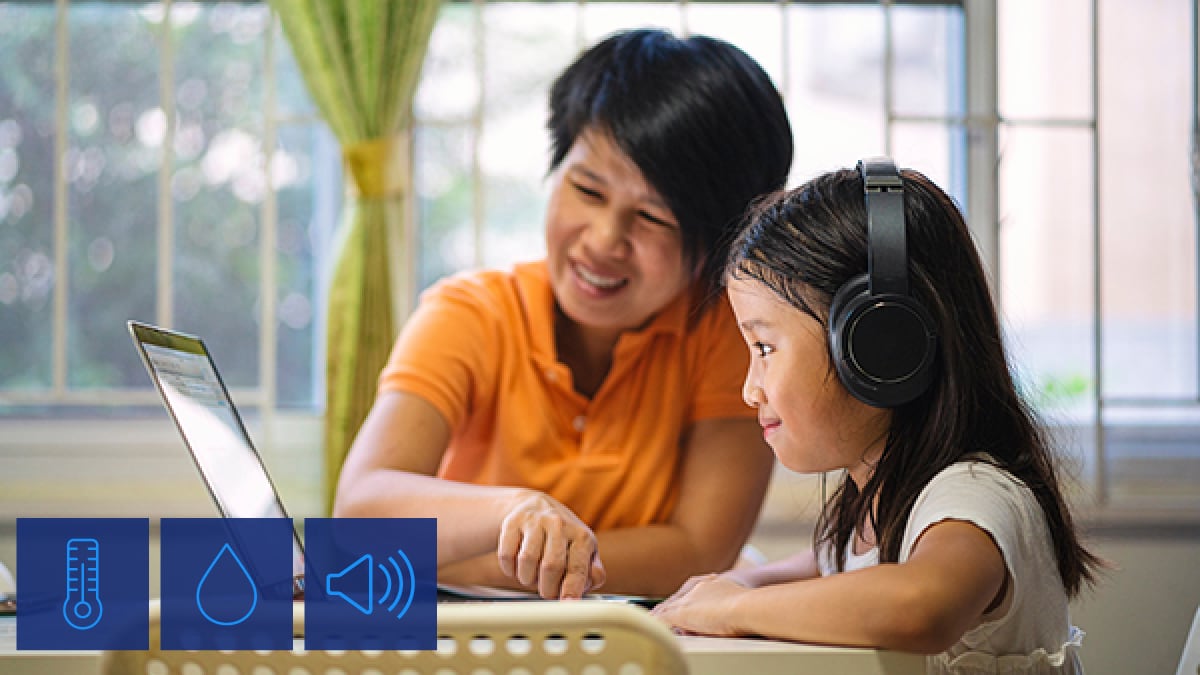 Carrier Healthy Homes. Infinity 26 Air Conditioner. mother and daughter on laptop