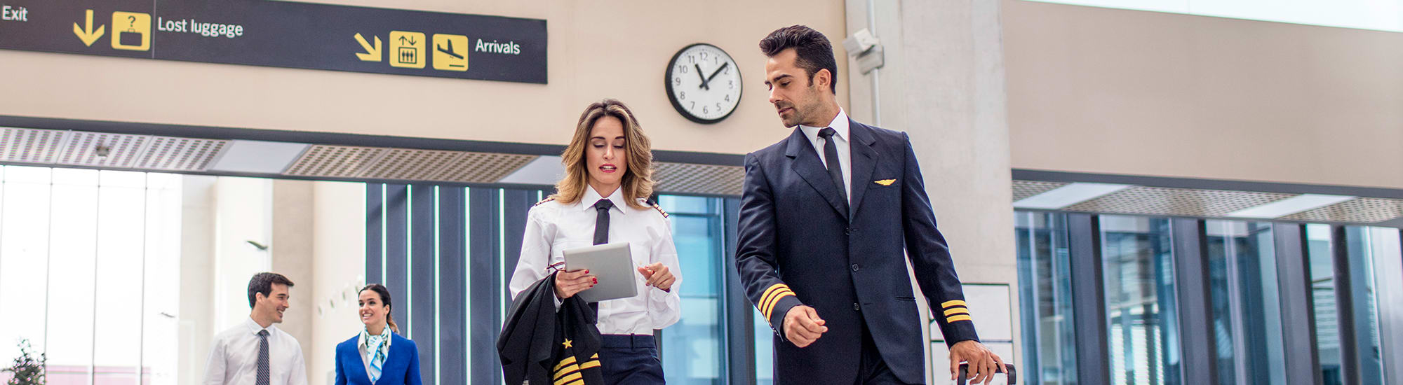 pilots-walking-secure-airport-2000x550