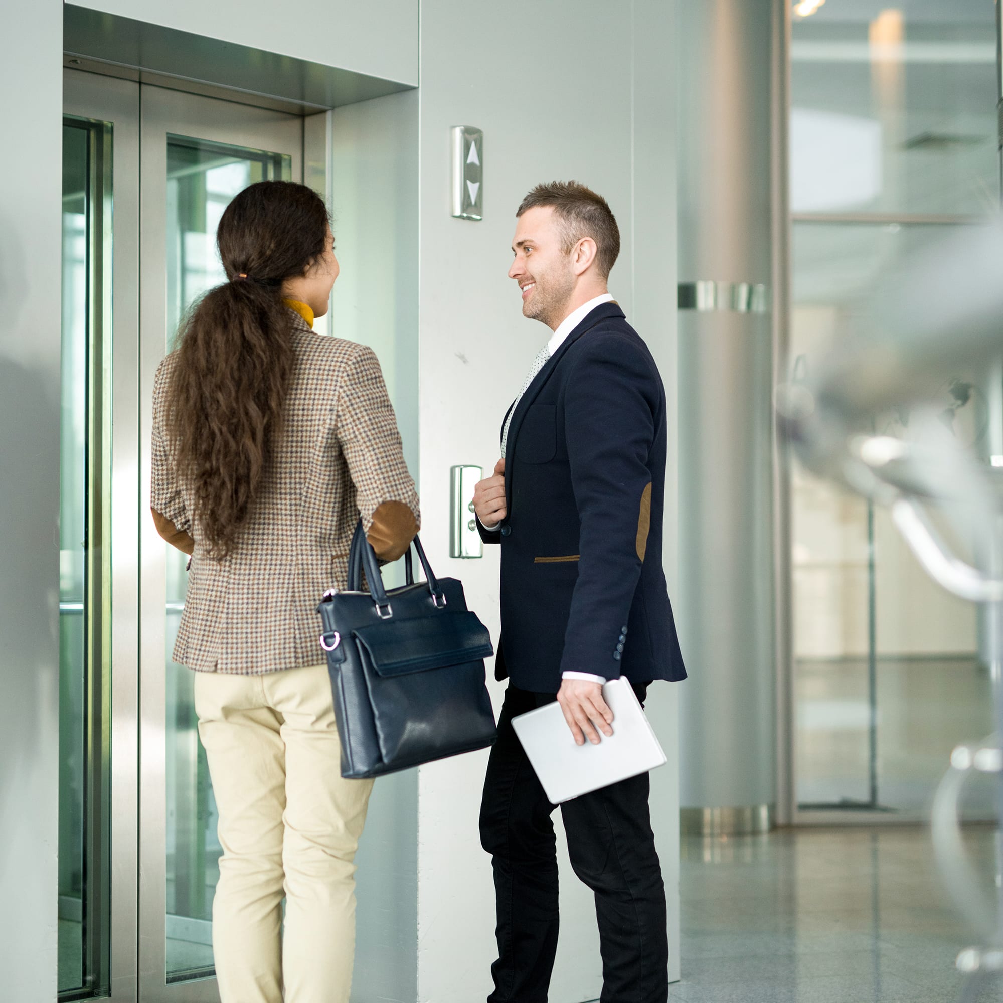 people-talking-outside-of-elevator-1x1