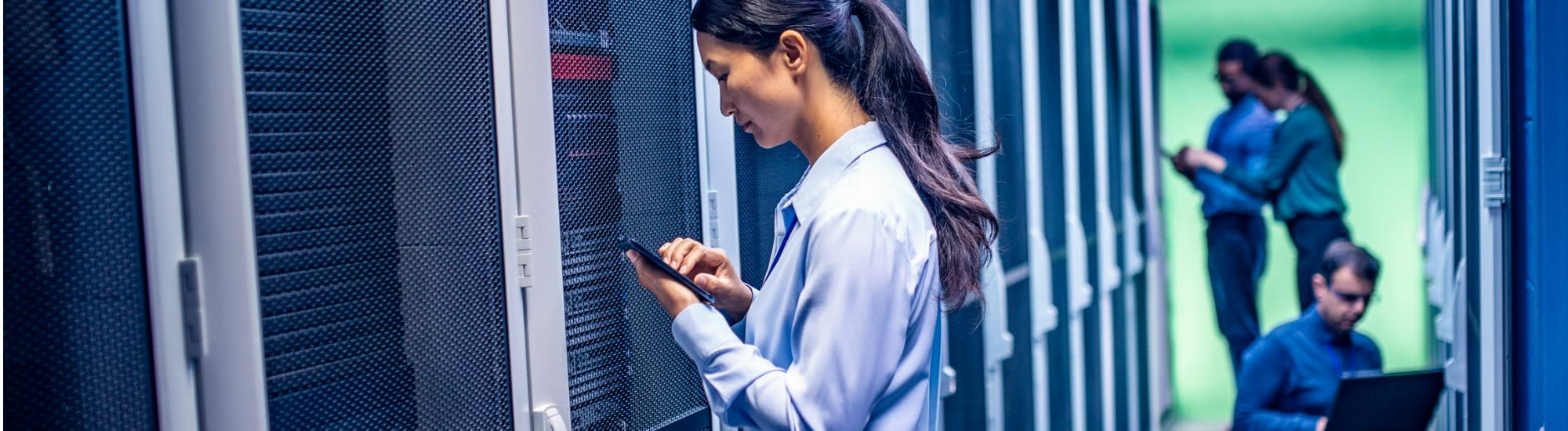 team-of-engineers-working-in-server-room-2000x550