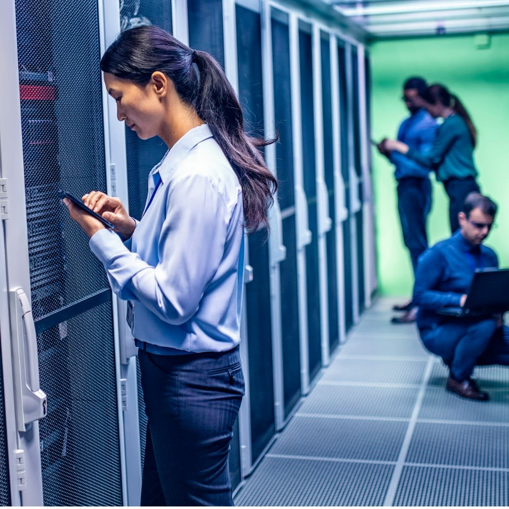 team-of-engineers-working-in-server-room-1x1