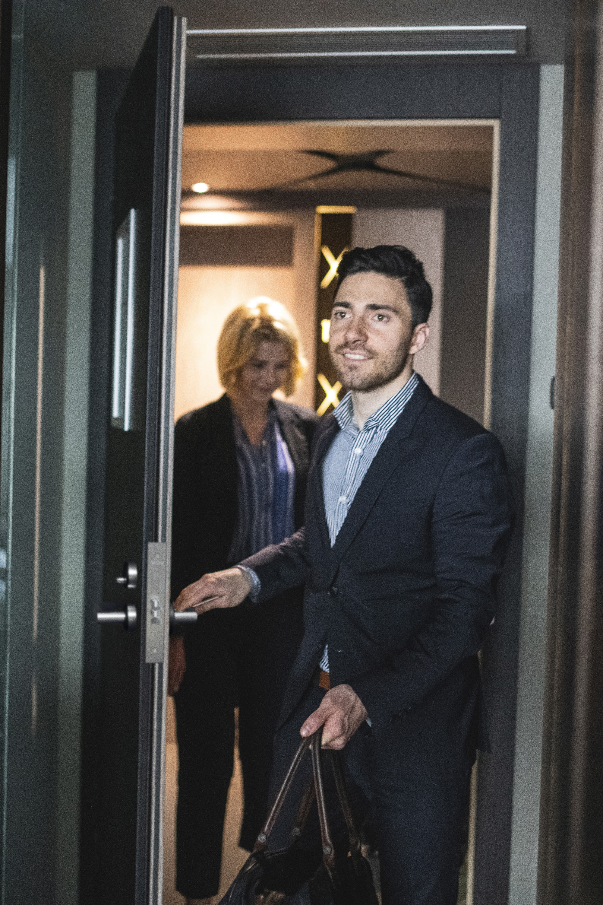 couple-entering-hotel-room-2x3