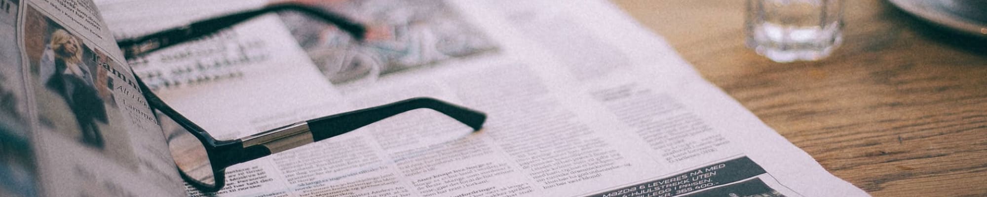 glasses-over-newspaper